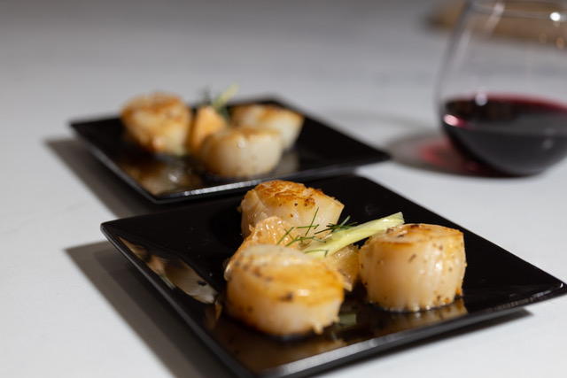 Seared Scallops with Wine: Beautifully seared scallops paired with fine wine